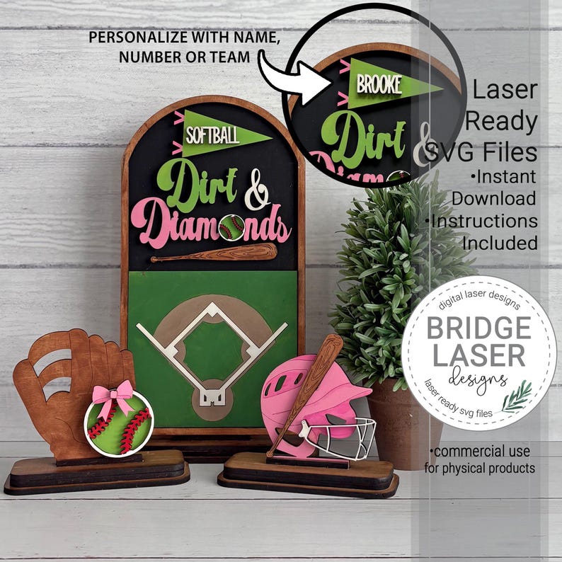 May include: A wooden softball-themed tiered tray decor set featuring an arched sign with the text Dirt & Diamonds, a baseball glove with a softball, and a pink batting helmet. The sign includes a green pennant with the text SOFTBALL or BROOKE.