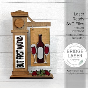 May include: A wooden sign with the text "BUT FIRST wine" and a hanging sign with a bottle of wine and two wine glasses. The sign is laser cut and ready to be assembled. The sign is perfect for a wine lover's home.