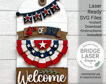 May include: A laser cut wooden sign with a 4th of July theme. The sign features a red, white, and blue banner, a star-shaped fan, and the words "4th of July" and "Welcome".