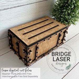 May include: A rectangular wooden box with a lid featuring three horizontal black slats. The box has dark brown edges and decorative small wooden accents along the sides. Text on the image reads: Bridge Laser Designs, laser digital cut files, Steamer Trunk Crate SVG Files, Interchangeable Files Sold Separately.
