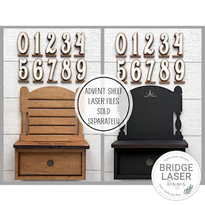 May include: Two wooden advent shelf designs, one stained brown and the other black, each with a drawer and a decorative back. Above each shelf are wooden numbers 0-9. The text reads "ADVENT SHELF LASER FILES SOLD SEPARATELY".