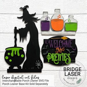 May include: A black silhouette of a witch stirring a green cauldron with a wooden spoon. The witch is standing on a black base with a spider. There are three glass bottles with purple, orange, and green liquids on a shelf above the witch. A black sign with the text "WELCOME MY PRETTIES" is on the right side of the image.