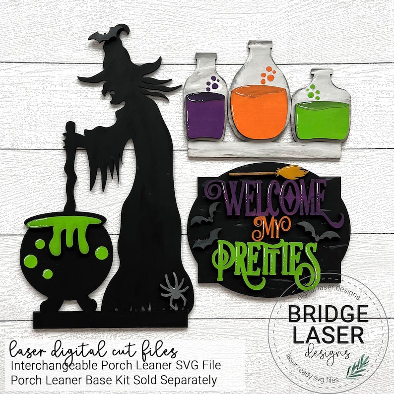 May include: A black silhouette of a witch stirring a green cauldron with a wooden spoon. The witch is standing on a black base with a spider. There are three glass bottles with purple, orange, and green liquids on a shelf above the witch. A black sign with the text "WELCOME MY PRETTIES" is on the right side of the image.