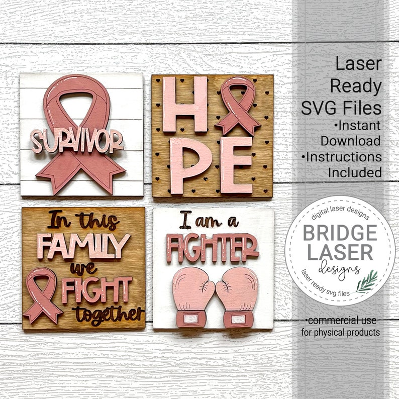 K&ouml;nnte beinhalten: Vier Holzschildchen mit rosa und wei&szlig;er Farbe. Die Schilder zeigen die Worte "Survivor", "Hope", "In this family we fight together" und "I am a fighter". Jedes Schild hat ein rosa Band, ein rosa Herz oder rosa Boxhandschuhe.