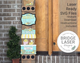 May include: A wooden sign with a lemon theme. The sign has multiple sections with the words "Squeeze the Day", "Lemonade", and "Farm Fresh Lemons". The sign also features a basket of lemons, a lemonade stand, and a pitcher of lemonade. The sign is laser-ready SVG files.