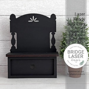 May include: A black wooden bench with a drawer, featuring a decorative back with a floral design. The bench is laser-ready and includes SVG files for instant download. The design is suitable for commercial use for physical products.
