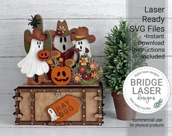 May include: A wooden box with a tag reading HAY BOO and a ghost, topped with three ghost figures wearing cowboy hats, pumpkins, sunflowers, and a spider. Text on the right reads Laser Ready SVG Files, Instant Download, Instructions Included.