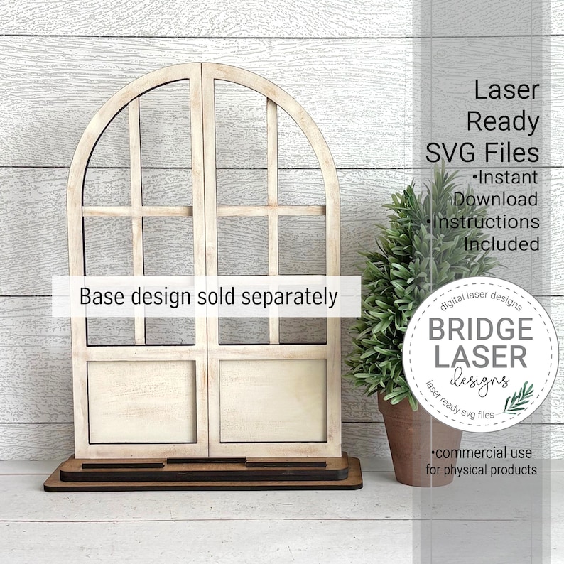 May include: A wooden arched window frame with a dark brown base. The window is divided into four sections with a light beige finish. Text on the image reads "Laser Ready SVG Files" and "Base design sold separately". A small potted plant is to the right.