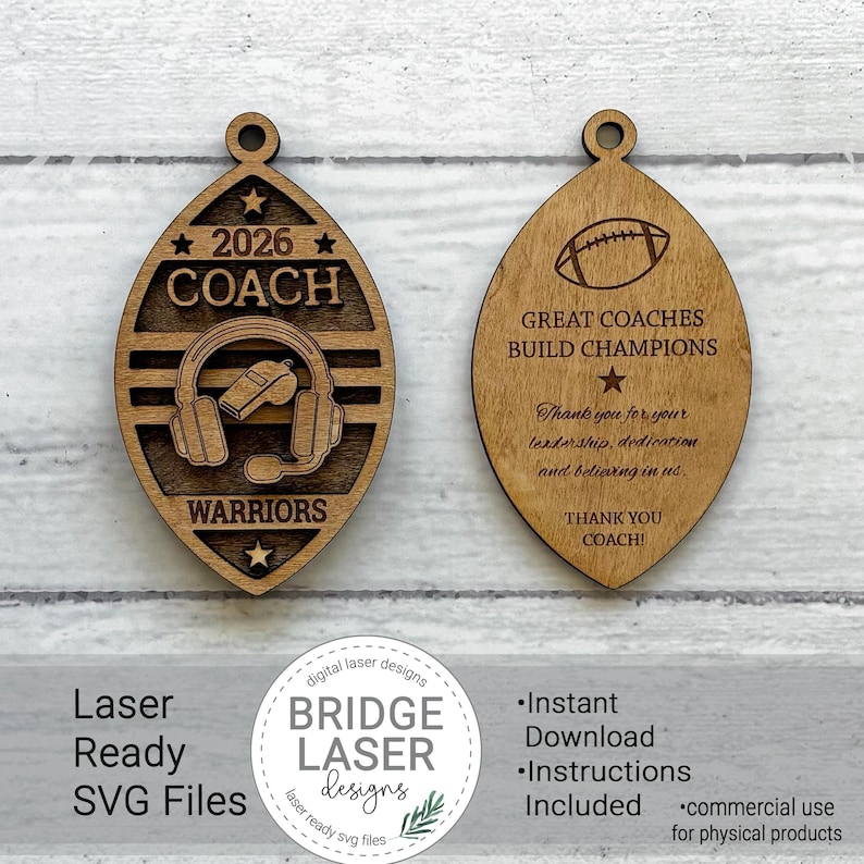 May include: Two oval-shaped wooden ornaments with a football-like silhouette. The left ornament features the text 2026, COACH, and WARRIORS with a headset and whistle graphic. The right ornament displays a football, the text GREAT COACHES BUILD CHAMPIONS, and a thank you message.