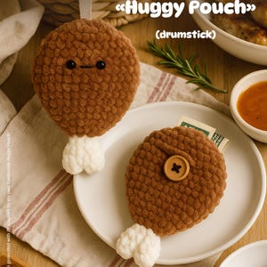 May include: Two brown crochet drumstick-shaped pouches with white bone-shaped bottoms. One has a face with black eyes and a stitched mouth. The other has a wooden button. The text "Huggy Pouch" and "drumstick" are visible.