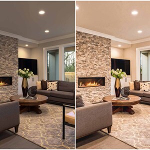May include: A living room with a stone fireplace, a gray couch, a coffee table, and a rug. The room is lit by recessed lighting.
