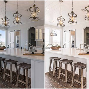 May include: A white kitchen island with three wooden stools. The island has a white countertop and a white backsplash. There are three black pendant lights hanging above the island.