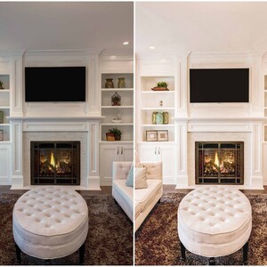 May include: A white fireplace with a black metal grate and a fire burning inside. The fireplace is surrounded by white built-in shelves with decorative items. There is a white ottoman in front of the fireplace and a white couch on each side.