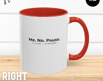 May include: White ceramic mug with a red rim and handle. The mug has the text "Me. No. Pause. It's my time - no interruptions!" printed on it. The mug is 11 ounces.