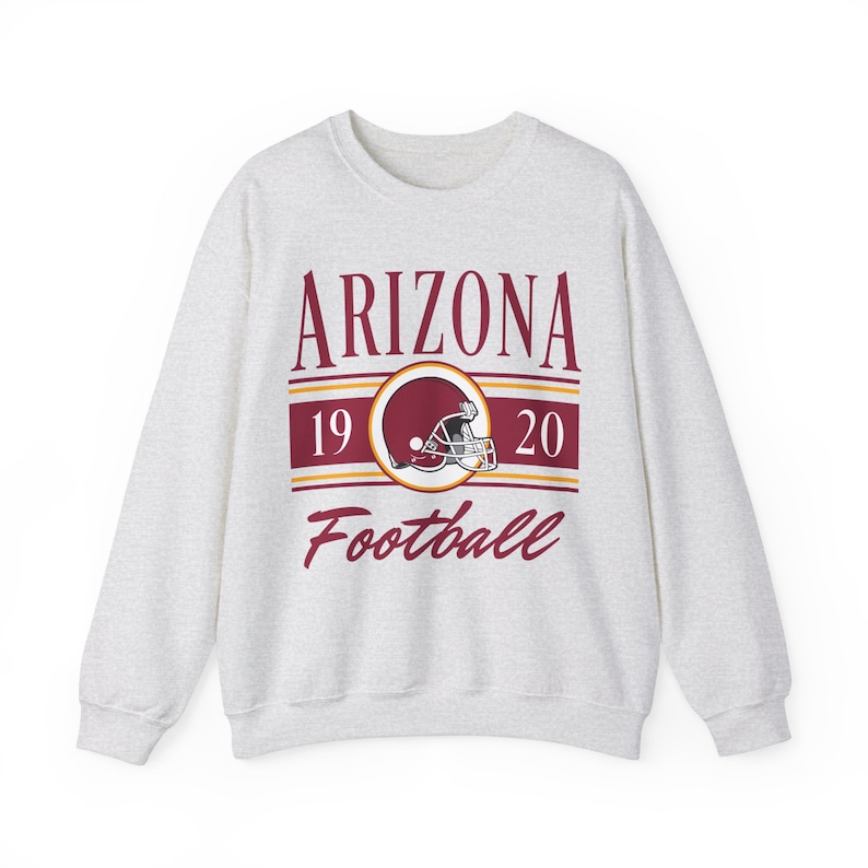 Light ash gray sweatshirt with a retro vintage Arizona Football design on the front, including the founding date (1920) of the Arizona Cardinals, and a seating chart layout design of State Farm Stadium across the back.