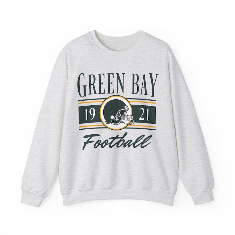 Light ash gray sweatshirt with a retro vintage Green Bay Football design on the front, including the founding date (1921) of the Green Bay Packers, and a seating chart layout design of Lambeau Field across the back.