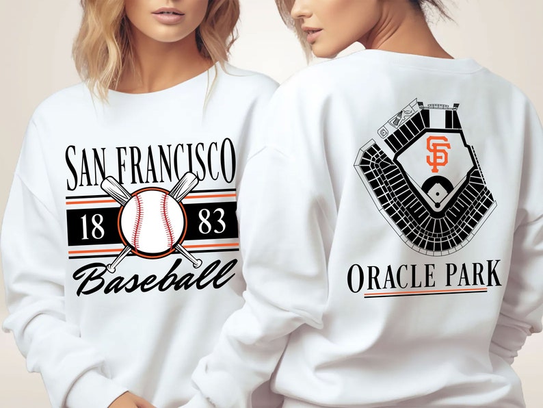 White sweatshirt with a retro vintage San Francisco Baseball design on the front, including the founding date (1883) of the San Francisco Giants, and a seating chart layout design of Oracle Park across the back.
