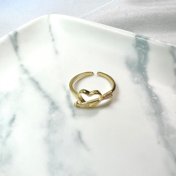 Ring with au and arrow through it deals