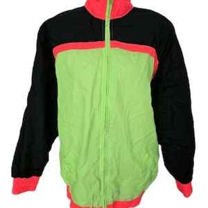May include: A vintage track jacket in a vibrant color block design. The jacket features a neon green center, black sleeves and upper back, and bright pink accents on the collar, cuffs, and waist. It has a full zipper closure.