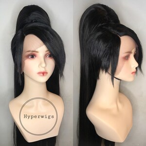 May include: A long black wig with a high ponytail and side bangs. The wig is styled with a high bun on top of the head. The wig is on a mannequin head. The text "Hyperwigs" is on the mannequin's chest.