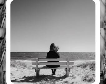 May include: Black and white journal cover with the text "Healing Through Heartbreak Journal." The image features a person sitting on a bench overlooking the ocean. The text "For the moments when your heart needs a safe place to land" is at the bottom.