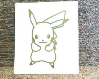 May include: A gold outline sticker of Pikachu, a popular Pokemon character, with a grumpy expression. The sticker is on a white background.
