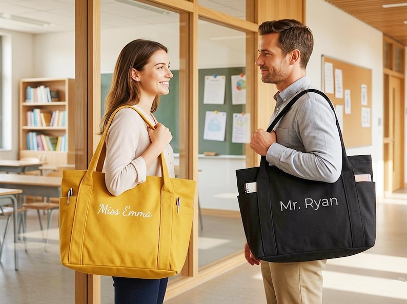 May include: Two tote bags, one mustard yellow and one black, are shown. The yellow bag has "Miss Emma" embroidered on it, and the black bag has "Mr. Ryan" embroidered on it. Both bags have multiple pockets and long handles.