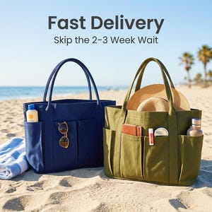 May include: Two canvas tote bags on a sandy beach. One is navy blue with sunglasses and sunscreen in the pockets. The other is olive green with a straw hat and other items. Text reads "Fast Delivery, Skip the 2-3 Week Wait."
