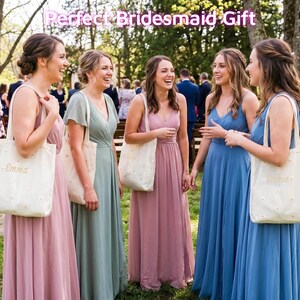 May include: Five women in long, flowing dresses of pink, green, and blue stand together outdoors. Each woman carries a white tote bag with a floral pattern and a name embroidered on it. The text "Perfect Bridesmaid Gift" is at the top.