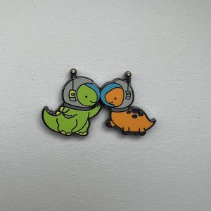 Duo Astronaut Dinosaur Pin
