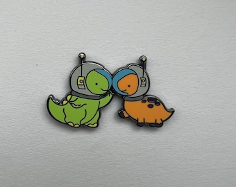 Broche dinosaure astronaute duo