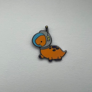 Orange Astronaut Dinosaur Pin