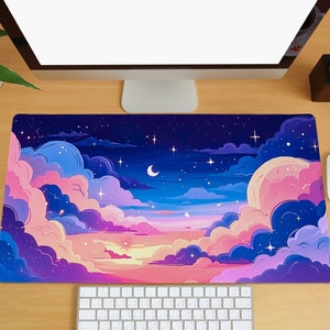 May include: A purple, pink, and blue galaxy-themed mousepad with a crescent moon and stars. The mousepad features a colorful sunset with clouds.