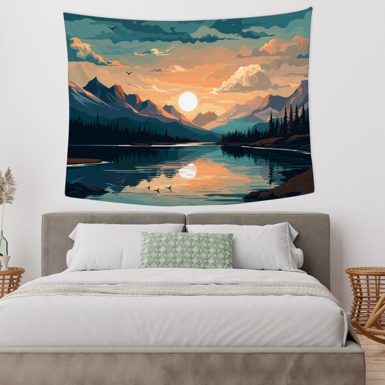 May include: A tapestry featuring a scenic landscape with a lake reflecting a sunset over mountains. The sky is a mix of blue, orange, and pink with fluffy clouds. The lake is a deep blue with a reflection of the sunset. The mountains are a dark blue and green.