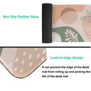May include: A beige and green desk mat with an abstract design. The mat has a non-slip rubber base and a locked edge design to prevent rolling.