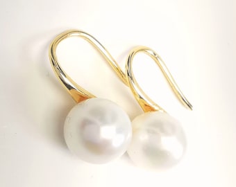 Pearls with certificate for these 9mm white cultured pearl earrings on large gold-plated pendants