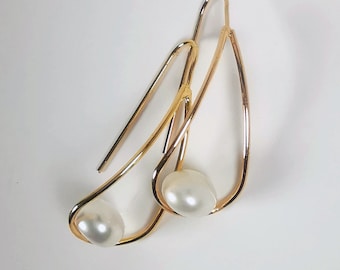 Pearls with certificate for these 8mm white cultured pearl earrings on long gold-plated pendants