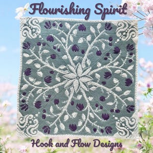 May include: A square, crocheted textile with a floral design. The central motif is a large, white flower, with white vines and purple flower buds radiating outwards. The border is white with decorative scrollwork. The text "Flourishing Spirit" and "Hook and Flow Designs" are visible.