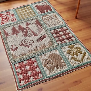 May include: A handmade, square crochet rug with a patchwork design. The rug features various squares with nature-themed motifs, including a bear, owl, butterfly, and camping scene. The colour palette includes shades of red, green, brown, and cream.