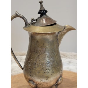 Antique Footed Silver-Plated Creamer with lid.