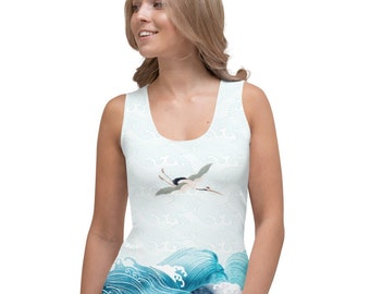 May include: A sleeveless vest top with a Japanese-inspired design. It features a crane in flight above stylized ocean waves in shades of blue and white. The background has a subtle wave pattern.
