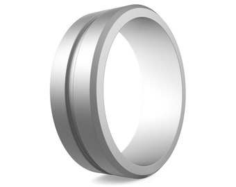 May include: A silver ring with a grooved design. The ring is made of a smooth, polished metal.