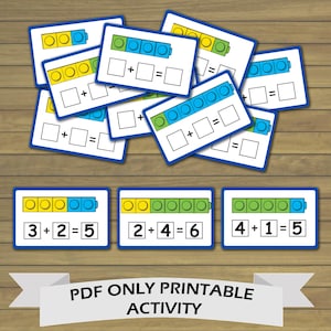 May include: Printable maths activity cards featuring colourful blocks with numbers and addition equations. The cards show different combinations of blocks and the corresponding addition problems. The text "PDF ONLY PRINTABLE ACTIVITY" is at the bottom of the image.