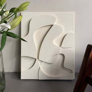 Textured and minimalist graphic wall piece. Modern monochromatic shapes. Minimalist style decor. Art sculpture.