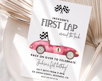 May include: A white invitation card with a watercolor illustration of a pink race car and checkered flags. The text reads "Jackson's First Lap" and "Race on over to celebrate Jackson's first birthday!" with event details.