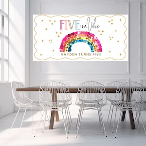 May include: A rectangular white sign with a scalloped gold border featuring the text FIVE IS A Vibe in colorful letters, a rainbow made of multicolored circles, and the text HAYDEN TURNS FIVE, surrounded by small gold star icons.