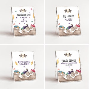 May include: Four printable signs with monster truck graphics and text. The signs say "Unloading Zone Cards & Gifts", "VIP Lounge Pit Crew Treats", "Refueling Station", and "Party Favors Please Take One For The Road".