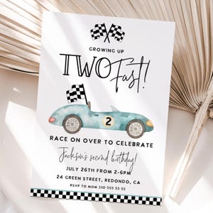 May include: A birthday invitation featuring a light blue race car illustration. The text says "Growing Up Two Fast!" and "Race on over to celebrate Jackson's second birthday!" with event details.