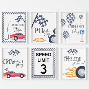 May include: Six framed prints with a racing theme. Each print features racing flags, cars, and text such as "Refueling Station," "Pit Stop," "Cards & Gift," "Crew Treats," "Speed Limit 3," and "Take One for the Road."