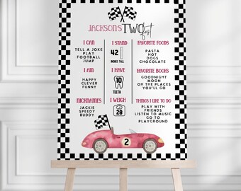 May include: A pink and white birthday sign on an easel. The sign has a checkered border and includes the text "Jackson's Two Fast". It lists the child's height as 42 inches, weight as 28 pounds, and favorite things.